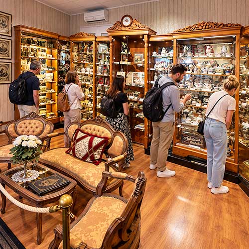 Warm Antique Museum Interior with Curious Visitors