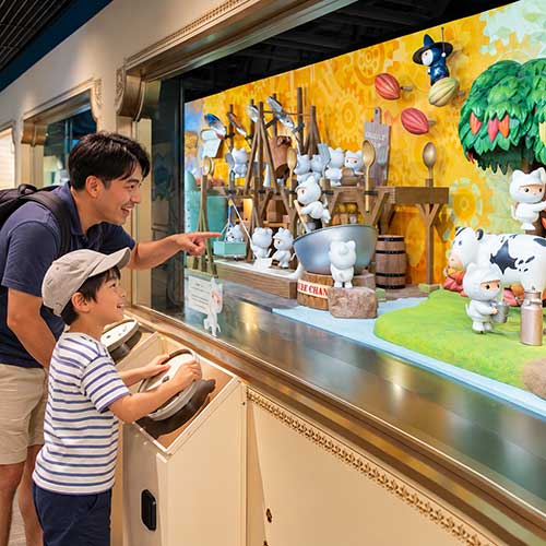 ather and Son Explore Chocolate Exhibit